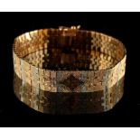 Property of a lady- an 18ct three-colour gold link bracelet, marked 750, 7.8ins. (19.8cms.) long,