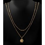 Property of a lady - a long 9ct gold guard chain, 56.75ins. (144cms.) long, with 9ct gold ball