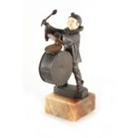 Property of a lady - an Art Deco bronze & ivory figure of a bass drum player, AT monogram in the