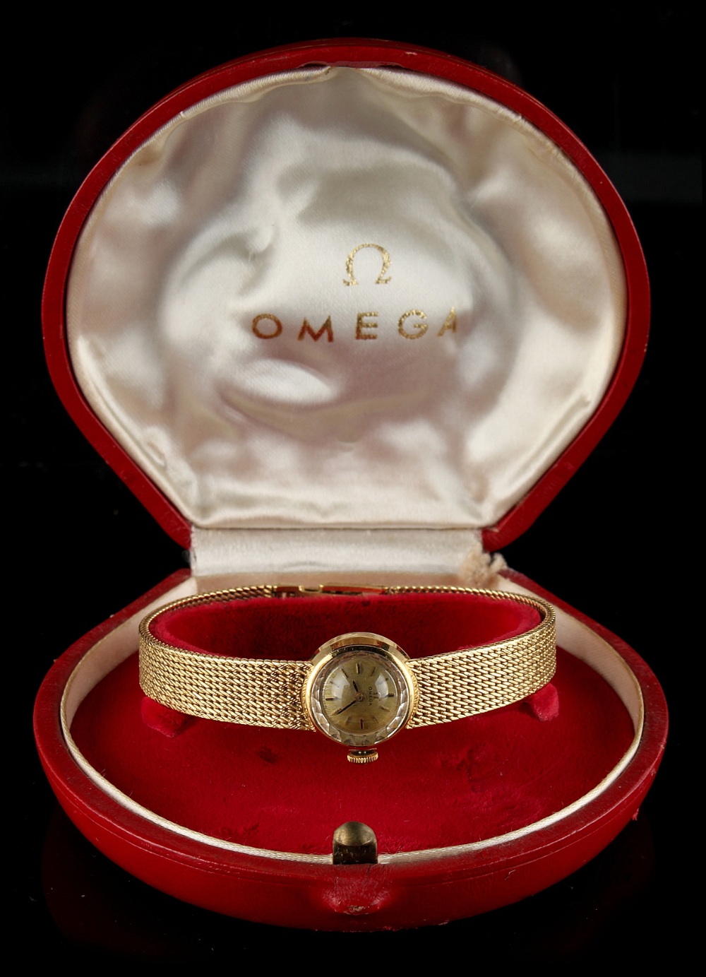 Property of a deceased estate - a lady's Omega 18ct yellow gold cased wristwatch with integral