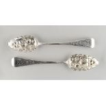 Property of a deceased estate - a pair of George III later repousse berry decorated table spoons,