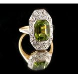 A 14ct yellow gold peridot & diamond ring, the octagonal cut peridot weighing approximately 4.28