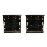 A pair of 19th century gilt metal & Sevres style porcelain mounted ebonised open bookcases, with