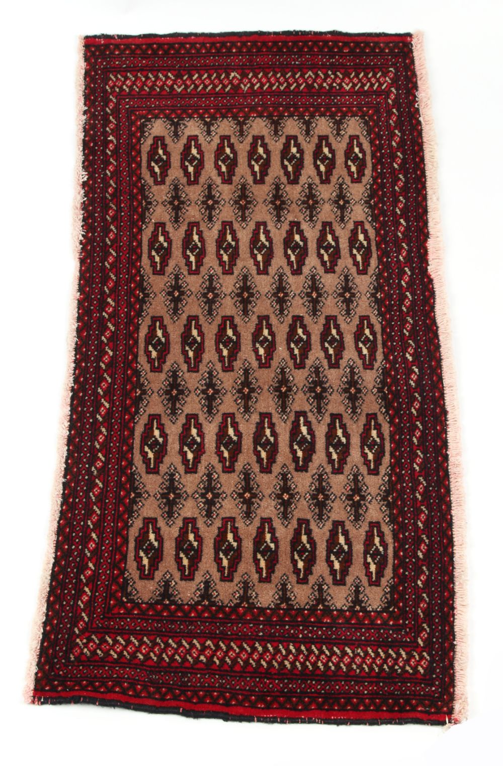 A Turkoman woollen hand-made rug with dark red ground, 50 by 24ins. (127 by 61cms.)