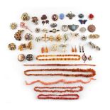 Property of a lady - a bag containing assorted costume jewellery including a garnet brooch &