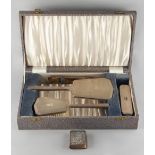 Property of a deceased estate - a silver backed four piece mirror & brush set, with engine turned