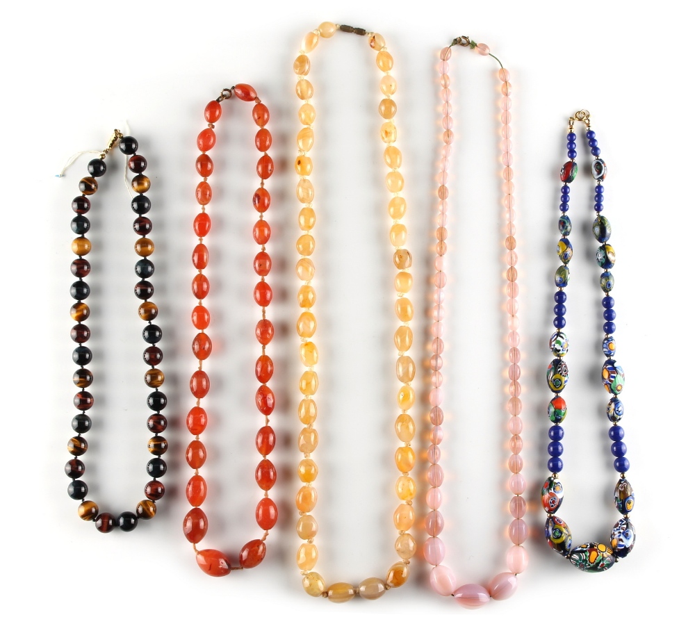 Property of a lady - five assorted bead necklaces including a tiger's eye necklace, an agate oval