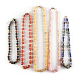 Property of a lady - five assorted bead necklaces including a tiger's eye necklace, an agate oval