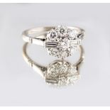 An Art Deco style 18ct white gold & platinum diamond cluster ring, set with two baguette cut