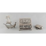 Property of a lady - a late Victorian silver square box with repousse decoration depicting putti,