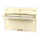 Property of a lady - a Zender white cased upright piano, 52ins. (132cms.) wide.