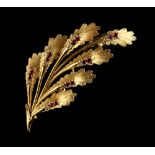 Property of a deceased estate - an 18ct yellow gold ruby & diamond leaf brooch, 52mm long,