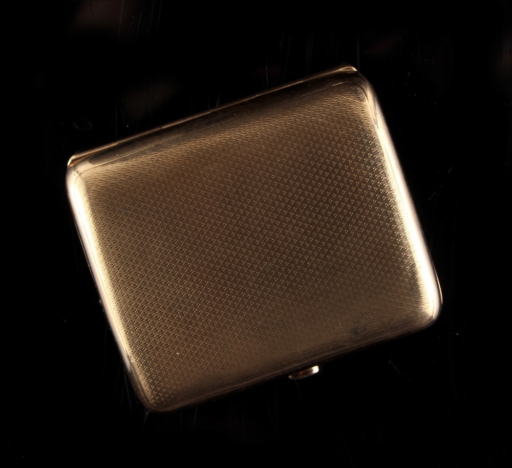 Property of a lady - a 9ct gold cigarette case, with engine turned decoration, 3.15ins. (8cms.)