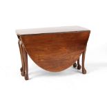 An 18th century George III Irish mahogany oval topped drop-leaf dining table with six carved