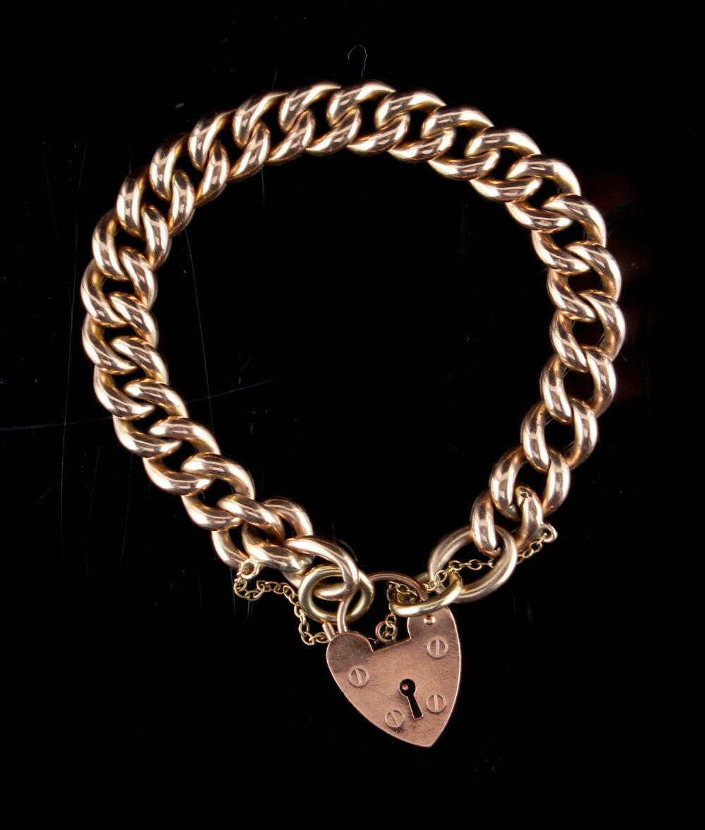 Property of a lady - a 9ct gold chain bracelet with heart shaped lock clasp, with safety chain,