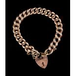 Property of a lady - a 9ct gold chain bracelet with heart shaped lock clasp, with safety chain,