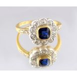 A 14ct yellow gold sapphire & diamond flowerhead cluster ring, the square cushion cut sapphire