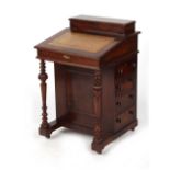 Property of a gentleman - a late Victorian walnut davenport, with beige leather inset top. 21ins. (