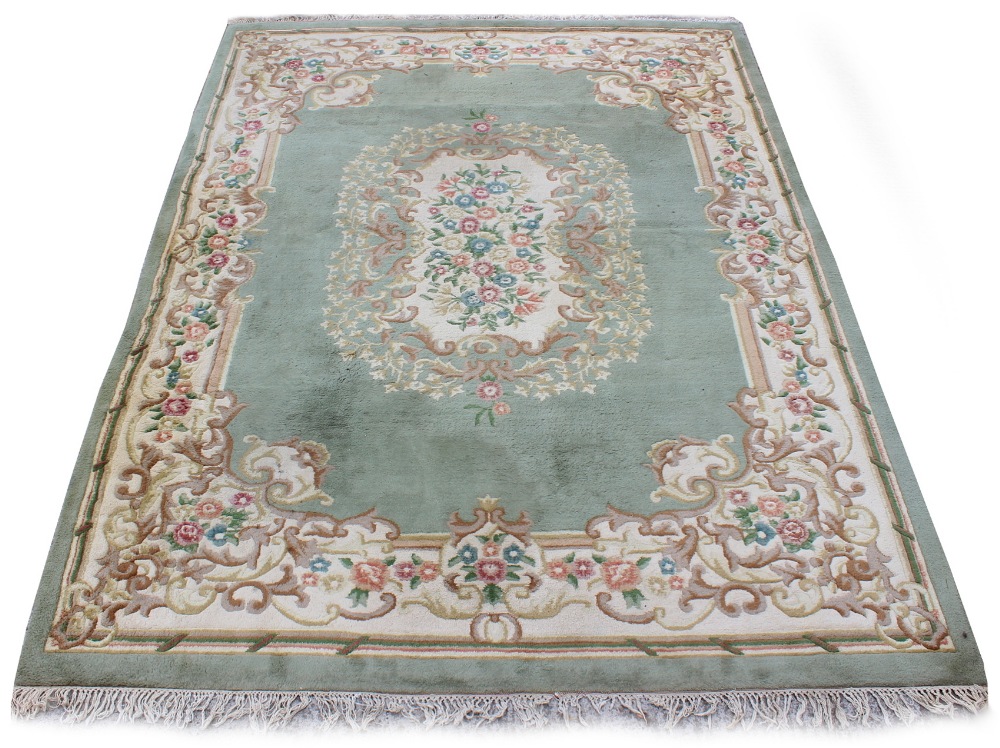 Property of a gentleman - a hand knotted wool carpet, late 20th century, with greyish green