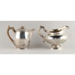 Property of a deceased estate - a George III silver hot water jug, London 1809, 4.3ins. (11cms.)