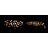 Property of a deceased estate - a 9ct gold brooch set with a pale blue stone, boxed; together with