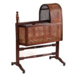 Property of a gentleman - an early 19th century George IV mahogany & cane panelled swinging crib