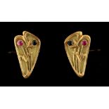 An unusual pair of Russian Art Nouveau gold plique a jour ruby & sapphire cufflinks, Moscow 56