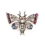 A 19th century ruby sapphire diamond & pearl butterfly brooch, approximately 7.8 grams, 37mm wide.