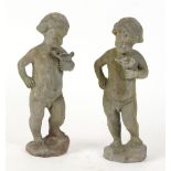 Property of a lady - a pair of lead statues of putti, 16ins. (40.5cms.) high.