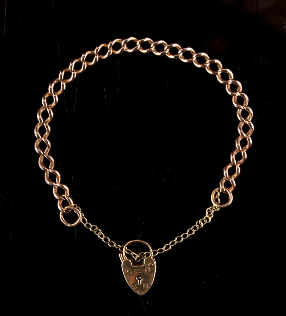 Property of a deceased estate - a 15ct gold chain bracelet with 9ct gold heart locket, approximately