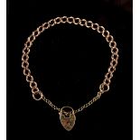 Property of a deceased estate - a 15ct gold chain bracelet with 9ct gold heart locket, approximately