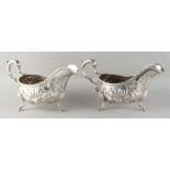 Property of a gentleman - a pair of mid 18th century George II / III Irish silver sauce boats, of