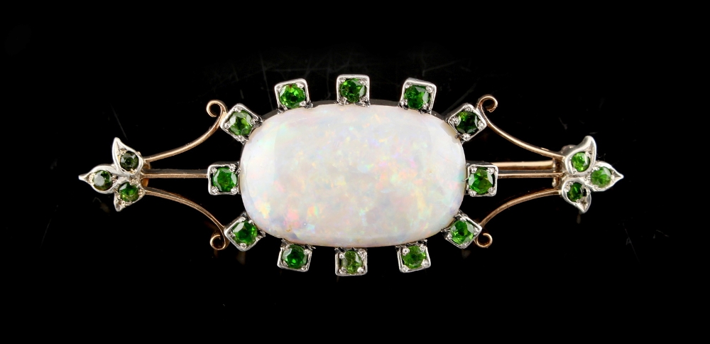 An opal & demantoid garnet brooch, the oval opal measuring approximately 23 by 15mm, approximately - Image 2 of 2