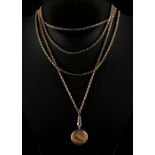 Property of a lady - a 9ct gold locket pendant on 9ct gold long chain, approximately 27.9 grams