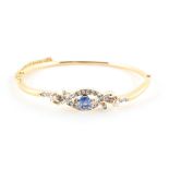 A late 19th / early 20th century Austrian 18ct yellow gold sapphire & diamond hinged bangle, the