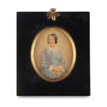 Property of a lady - a late 19th century portrait miniature depicting a lady wearing a blue dress,