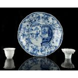 A Chinese blue & white shallow dish, Kangxi period (1662-1722), with alternating panels of ladies