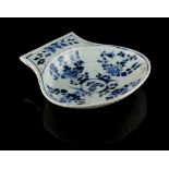 A Chinese blue & white scallop shell shaped dish, 17th / 18th century, 6.4ins. (16.2cms.) wide.