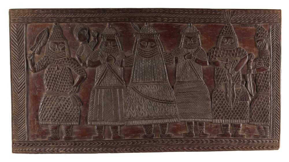 An early 20th century Benin carved wood rectangular panel depicting six standing figures & a