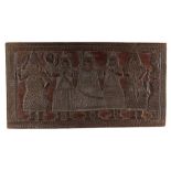 An early 20th century Benin carved wood rectangular panel depicting six standing figures & a