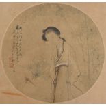 A late 19th century Chinese painting on circular silk panel depicting a lady by bamboo, with