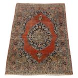 Property of a gentleman - an antique Bidjar rug, with red field, 68 by 51ins. (173 by 130cms.).