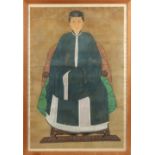 A 19th century Chinese painting on silk depicting an official's wife, in glazed frame, 57.1 by 39.
