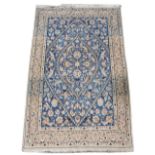 Property of a gentleman - a Persian Qum rug with pale blue & ivory ground, 79 by 49ins. (210 by