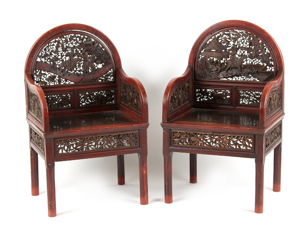 A pair of late 19th century Chinese carved red lacquer throne chairs (2).