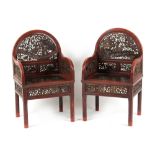 A pair of late 19th century Chinese carved red lacquer throne chairs (2).