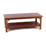 Property of a lady - a reproduction mahogany rectangular two tier coffee table with inset red