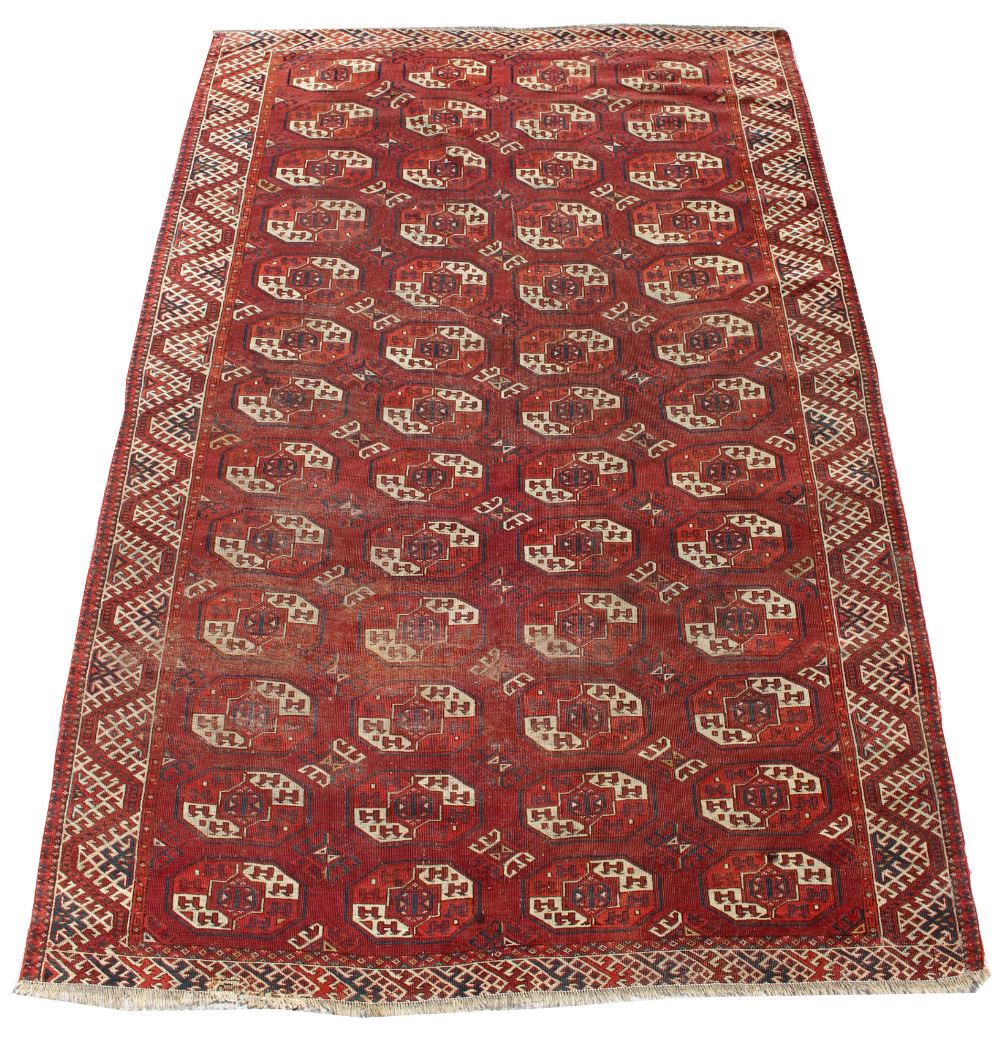 Property of a gentleman - an early / mid 20th century Turkoman carpet, 112 by 76ins. (284 by