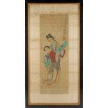 An early 20th century Chinese painting on silk depicting a standing lady & attendant, with