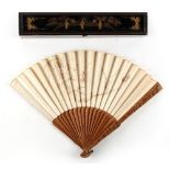 A 19th century Chinese carved sandalwood & embroidered silk fan depicting a bird, butterflies &